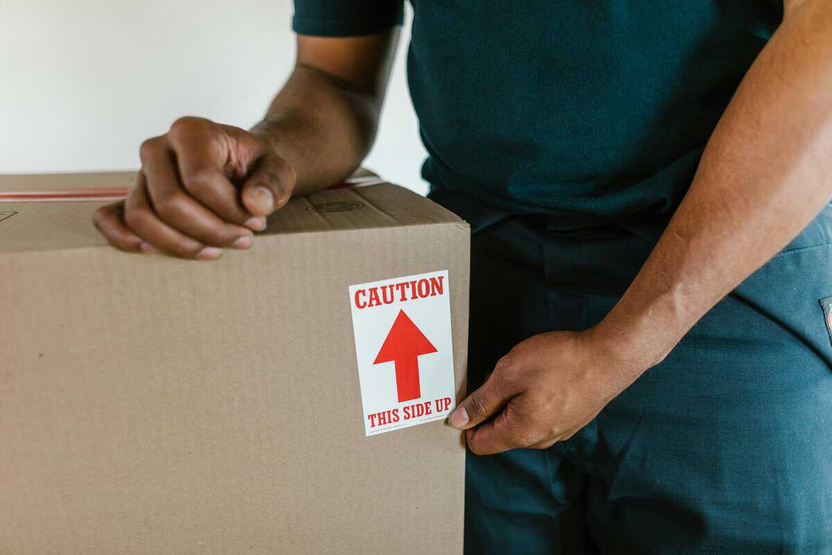 box with caution tag